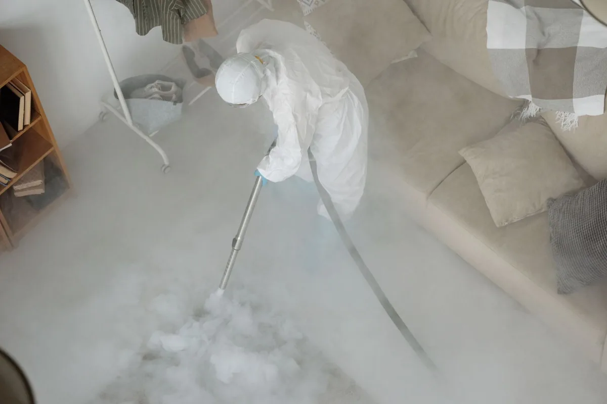 Biohazard cleanup technician in protective equipment, West Allis, WI